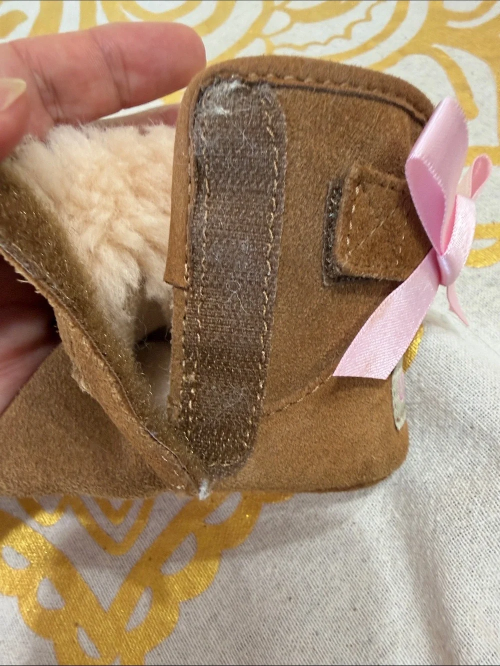 UGG Kids Brown Shearling Boots with Pink Ribbon